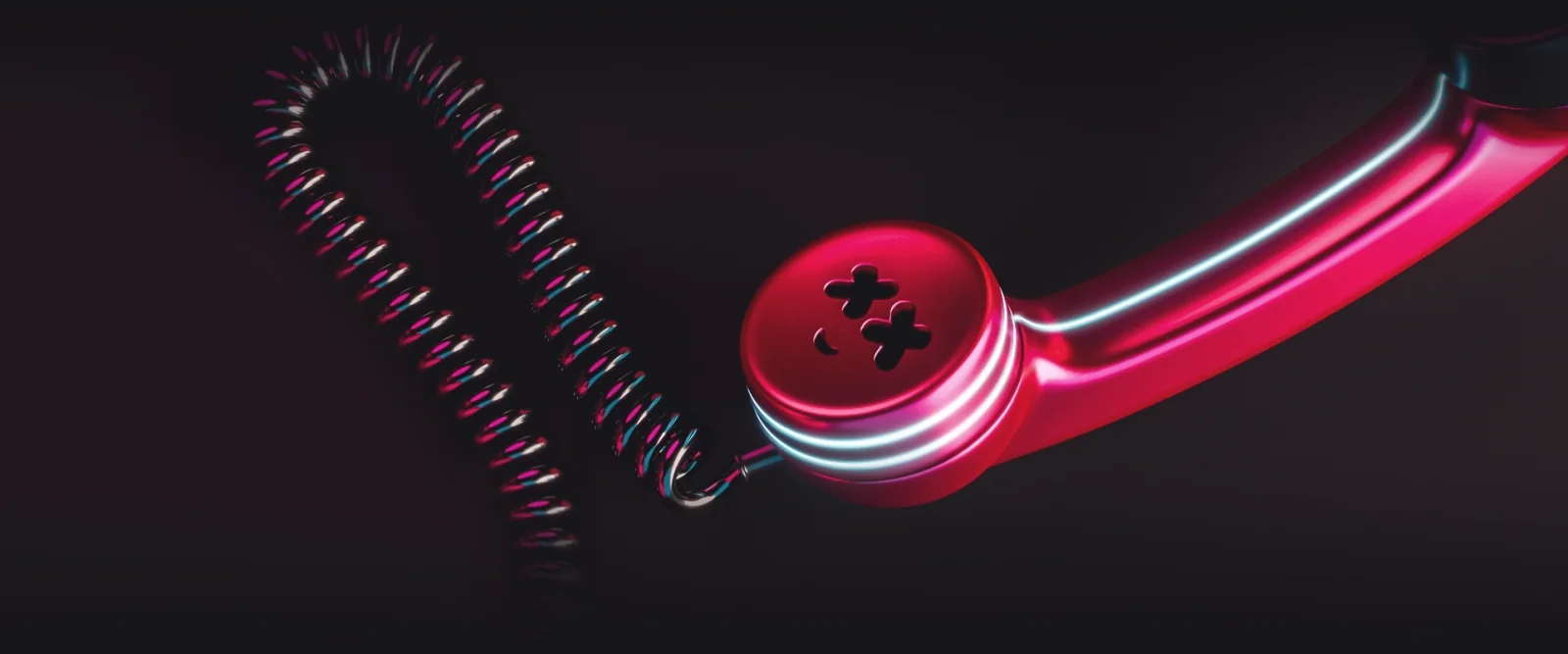 A red chrome telephone receiver and coiled cable